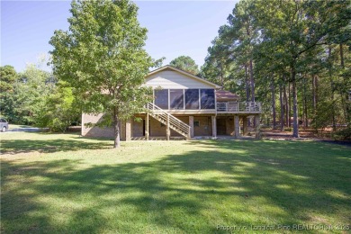 Welcome to this stunning 3-bedroom, 3-bath all-brick home on Woodlake Country Club in North Carolina - for sale on GolfHomes.com, golf home, golf lot