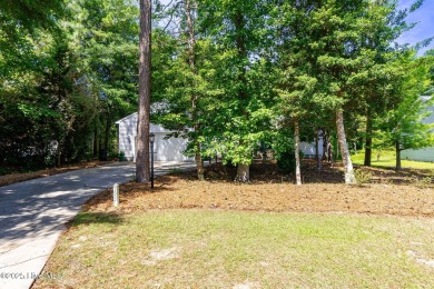 This charming 3-bedroom, 2-bath home is nestled in the desirable on The Country Club of the Crystal Coast in North Carolina - for sale on GolfHomes.com, golf home, golf lot