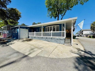 2 BED/2 BATH BEACH HOUSE IN OCEAN LAKES WITH WRAPAROUND COVERED on Prestwick Country Club in South Carolina - for sale on GolfHomes.com, golf home, golf lot