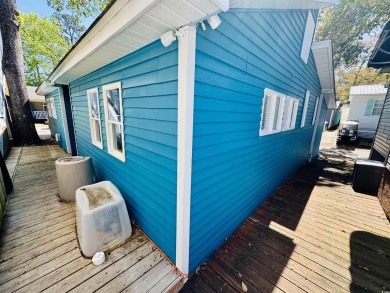 2 BED/2 BATH BEACH HOUSE IN OCEAN LAKES WITH WRAPAROUND COVERED on Prestwick Country Club in South Carolina - for sale on GolfHomes.com, golf home, golf lot