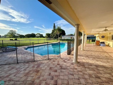 Stunning 4-Bedroom, 4-Bathroom Home on Coral Springs Country on Country Club of Coral Springs in Florida - for sale on GolfHomes.com, golf home, golf lot