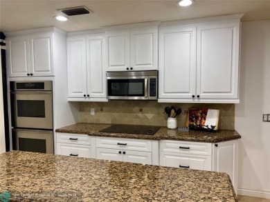 Stunning 4-Bedroom, 4-Bathroom Home on Coral Springs Country on Country Club of Coral Springs in Florida - for sale on GolfHomes.com, golf home, golf lot