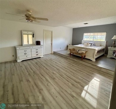 Stunning 4-Bedroom, 4-Bathroom Home on Coral Springs Country on Country Club of Coral Springs in Florida - for sale on GolfHomes.com, golf home, golf lot