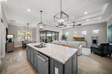 Built in 2022, this light-filled *Summerwood* floorplan home on Calusa Pines Golf Club in Florida - for sale on GolfHomes.com, golf home, golf lot