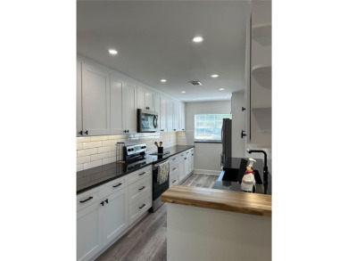 Welcome to this beautifully renovated 4-bedroom, 2-bathroom on Rocky Point Golf Course in Florida - for sale on GolfHomes.com, golf home, golf lot
