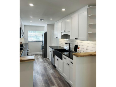 Welcome to this beautifully renovated 4-bedroom, 2-bathroom on Rocky Point Golf Course in Florida - for sale on GolfHomes.com, golf home, golf lot