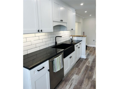 Welcome to this beautifully renovated 4-bedroom, 2-bathroom on Rocky Point Golf Course in Florida - for sale on GolfHomes.com, golf home, golf lot