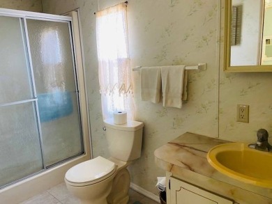 This home is in a 55 plus community with a monthly lot rent of on Crystal Lake Club in Florida - for sale on GolfHomes.com, golf home, golf lot