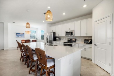 Beautiful Lakefront Coach Home with Golf Course Views! With over on Heritage Landing Golf  in Florida - for sale on GolfHomes.com, golf home, golf lot