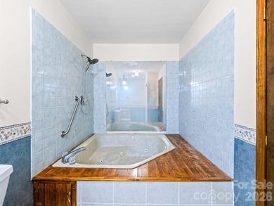 Resort home located at the tip of a quiet cul-de-sac street in on Rumbling Bald Resort on Lake Lure in North Carolina - for sale on GolfHomes.com, golf home, golf lot