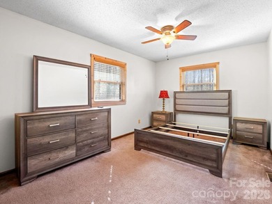 Resort home located at the tip of a quiet cul-de-sac street in on Rumbling Bald Resort on Lake Lure in North Carolina - for sale on GolfHomes.com, golf home, golf lot