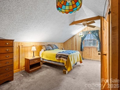 Resort home located at the tip of a quiet cul-de-sac street in on Rumbling Bald Resort on Lake Lure in North Carolina - for sale on GolfHomes.com, golf home, golf lot