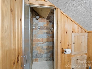 Resort home located at the tip of a quiet cul-de-sac street in on Rumbling Bald Resort on Lake Lure in North Carolina - for sale on GolfHomes.com, golf home, golf lot