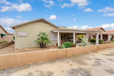 This gorgeous home in a 55+ gated resort offers great curb on Arizona Traditions Golf Club in Arizona - for sale on GolfHomes.com, golf home, golf lot