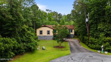Welcome to this charming 3-bedroom, 2-bathroom home offering 1 on Harbour Point Golf Club in North Carolina - for sale on GolfHomes.com, golf home, golf lot