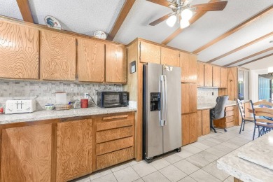 Beautifully remodeled triple-wide home offering 2 bedrooms, 2 on Painted Mountain Golf Club in Arizona - for sale on GolfHomes.com, golf home, golf lot