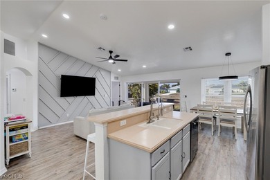 Beautifully updated 3-bedroom plus den, 2-bath home in SW Cape on Palmetto-Pine Country Club in Florida - for sale on GolfHomes.com, golf home, golf lot