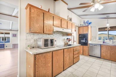 Beautifully remodeled triple-wide home offering 2 bedrooms, 2 on Painted Mountain Golf Club in Arizona - for sale on GolfHomes.com, golf home, golf lot