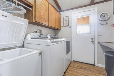 Beautifully remodeled triple-wide home offering 2 bedrooms, 2 on Painted Mountain Golf Club in Arizona - for sale on GolfHomes.com, golf home, golf lot