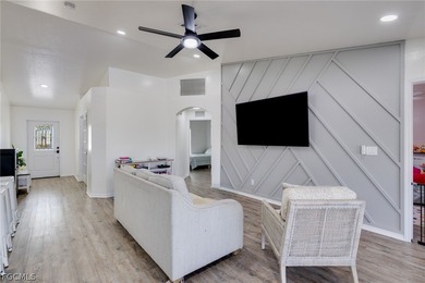 Beautifully updated 3-bedroom plus den, 2-bath home in SW Cape on Palmetto-Pine Country Club in Florida - for sale on GolfHomes.com, golf home, golf lot