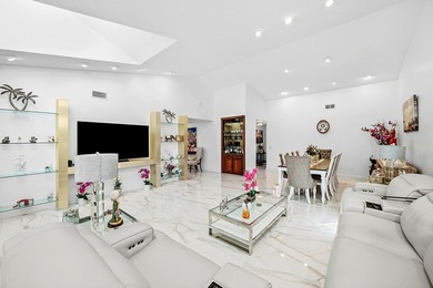 Enjoy comfortable South Florida living in this spacious 3-bed, 2 on Fountains Golf and Country Club in Florida - for sale on GolfHomes.com, golf home, golf lot