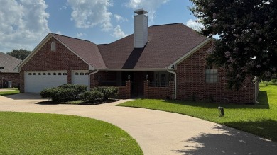 This exceptionally-updated 3 bedroom, 3 bathroom brick home in on Cedar Creek Country Club in Texas - for sale on GolfHomes.com, golf home, golf lot