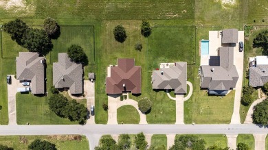 This exceptionally-updated 3 bedroom, 3 bathroom brick home in on Cedar Creek Country Club in Texas - for sale on GolfHomes.com, golf home, golf lot