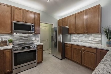 Immaculate condo in the highly sought-after Links of on The Fountains Golf Club in Michigan - for sale on GolfHomes.com, golf home, golf lot