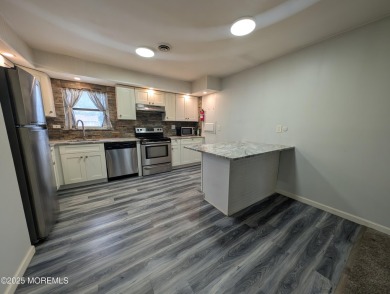 Lovely upper level Andover model with peaceful lakeviews from on Greenbriar Woodlands in New Jersey - for sale on GolfHomes.com, golf home, golf lot