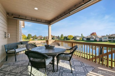 Tranquil lake views enhance the sense of calmness as you enter on Highland Meadows Golf Course in Colorado - for sale on GolfHomes.com, golf home, golf lot