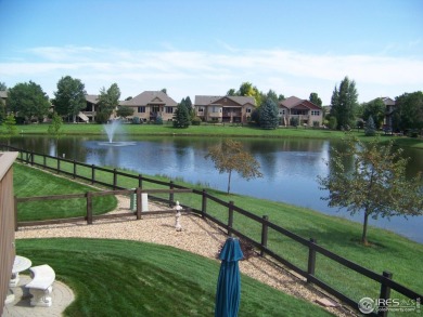 Tranquil lake views enhance the sense of calmness as you enter on Highland Meadows Golf Course in Colorado - for sale on GolfHomes.com, golf home, golf lot