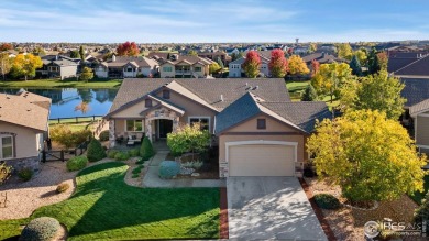 Tranquil lake views enhance the sense of calmness as you enter on Highland Meadows Golf Course in Colorado - for sale on GolfHomes.com, golf home, golf lot