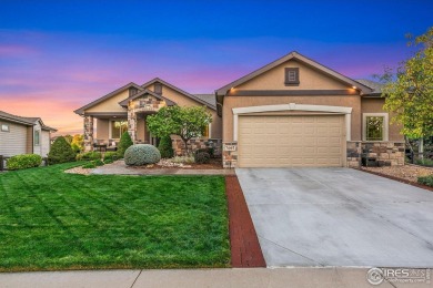 Tranquil lake views enhance the sense of calmness as you enter on Highland Meadows Golf Course in Colorado - for sale on GolfHomes.com, golf home, golf lot