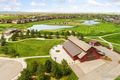 Tranquil lake views enhance the sense of calmness as you enter on Highland Meadows Golf Course in Colorado - for sale on GolfHomes.com, golf home, golf lot