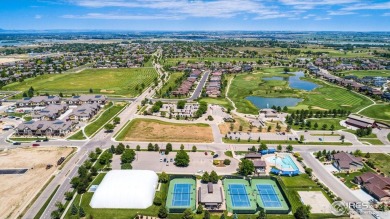 Tranquil lake views enhance the sense of calmness as you enter on Highland Meadows Golf Course in Colorado - for sale on GolfHomes.com, golf home, golf lot