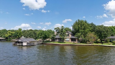 Set on a wide cove with open water views in the prestigious for sale on GolfHomes.com
