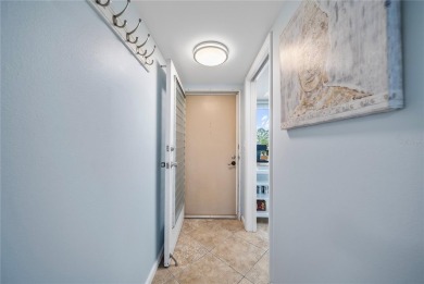 This beautifully updated two-bedroom, two-bath condo in the on Cove Cay Country Club in Florida - for sale on GolfHomes.com, golf home, golf lot