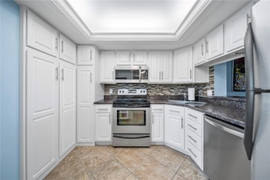 This beautifully updated two-bedroom, two-bath condo in the on Cove Cay Country Club in Florida - for sale on GolfHomes.com, golf home, golf lot