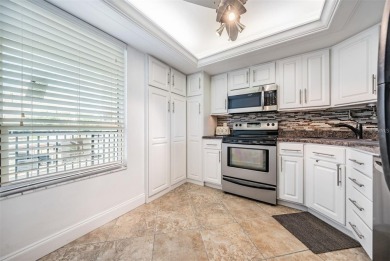 This beautifully updated two-bedroom, two-bath condo in the on Cove Cay Country Club in Florida - for sale on GolfHomes.com, golf home, golf lot