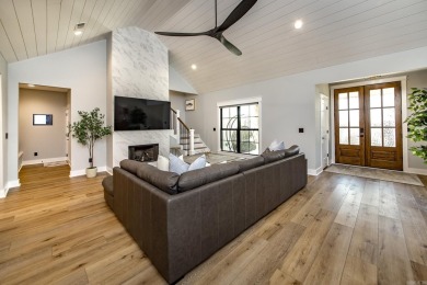 Welcome to your dream lakehouse featuring a boat slip. Enjoy on  in Arkansas - for sale on GolfHomes.com, golf home, golf lot