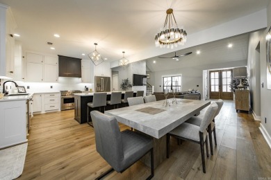 Welcome to your dream lakehouse featuring a boat slip. Enjoy on  in Arkansas - for sale on GolfHomes.com, golf home, golf lot