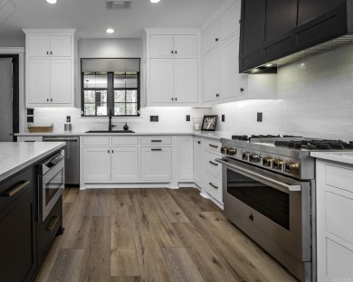 Welcome to your dream lakehouse featuring a boat slip. Enjoy on  in Arkansas - for sale on GolfHomes.com, golf home, golf lot