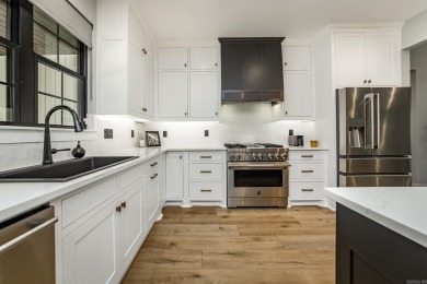 Welcome to your dream lakehouse featuring a boat slip. Enjoy on  in Arkansas - for sale on GolfHomes.com, golf home, golf lot