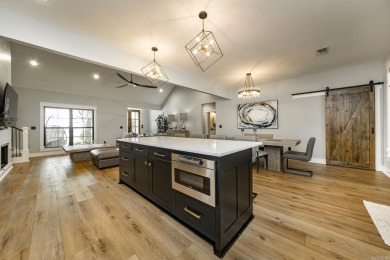 Welcome to your dream lakehouse featuring a boat slip. Enjoy on  in Arkansas - for sale on GolfHomes.com, golf home, golf lot