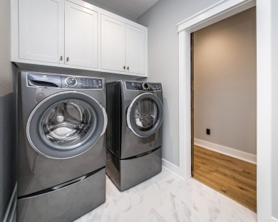 Welcome to your dream lakehouse featuring a boat slip. Enjoy on  in Arkansas - for sale on GolfHomes.com, golf home, golf lot