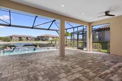 This stunning home overlooking a peaceful lake is located in one on Esplanade Golf and  Country Club in Florida - for sale on GolfHomes.com, golf home, golf lot