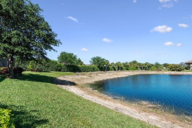 This stunning home overlooking a peaceful lake is located in one on Esplanade Golf and  Country Club in Florida - for sale on GolfHomes.com, golf home, golf lot