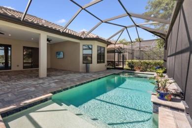 This stunning home overlooking a peaceful lake is located in one on Esplanade Golf and  Country Club in Florida - for sale on GolfHomes.com, golf home, golf lot