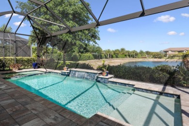 This stunning home overlooking a peaceful lake is located in one on Esplanade Golf and  Country Club in Florida - for sale on GolfHomes.com, golf home, golf lot