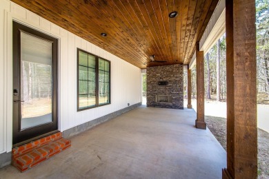 Welcome to your dream lakehouse featuring a boat slip. Enjoy on  in Arkansas - for sale on GolfHomes.com, golf home, golf lot